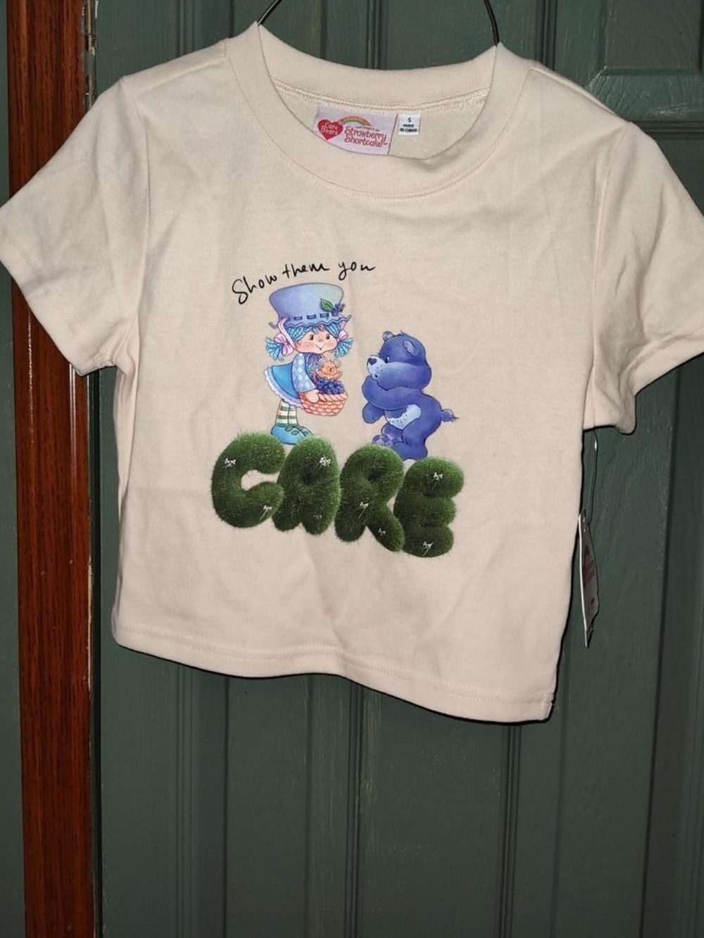 Women's Cream Graphic Tee with Care Bear/Strawberry Shortcake Collaboration